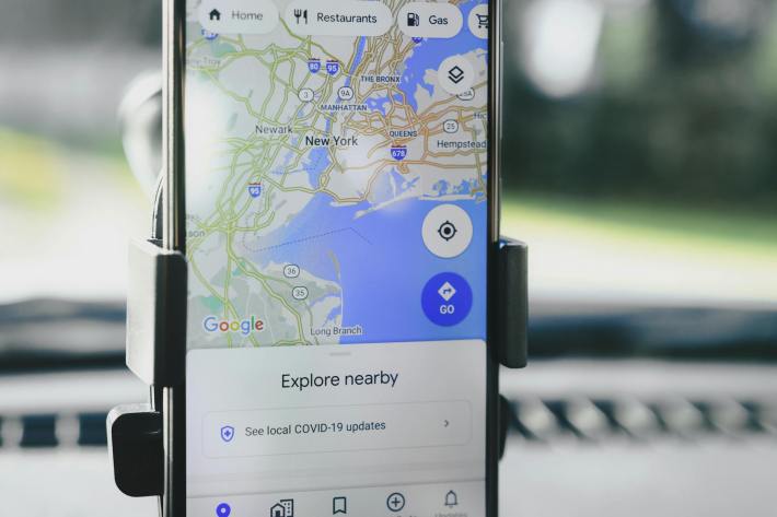 A smartphone displaying local SEO results on Google Maps